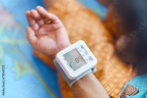 Self-measurement of blood pressure using a device on the wrist of the elderly.