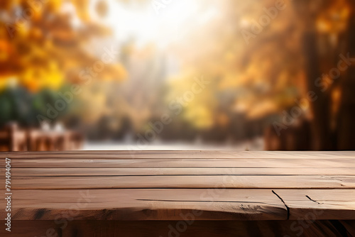 empty natural wooden table for display or product showcase with blurry autumn background scene