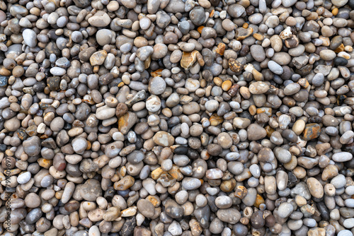 Famous round grey pebble on the Etretat beach. 