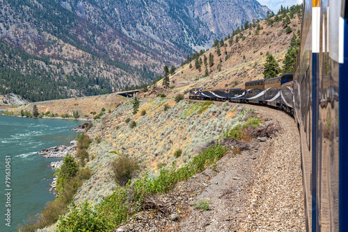 Rocky Mountaineer train along Fraser River, British Columbia, Canada.