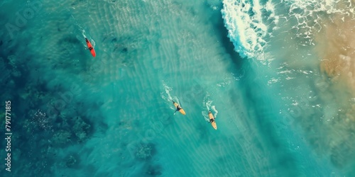 A group of surfers flying on their boards in the ocean, aerial view