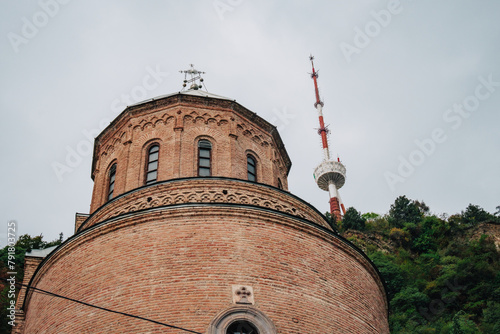 The tower of Mama Daviti church (also known as Mtatsminda Pantheo) and Tbilisi TV tower in Tbilisi (Georgia)