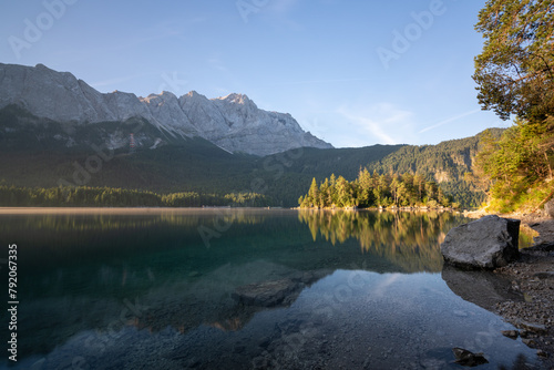 Lake eibsee at dawn with still water reflection