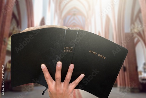 Holy bible book in human hands