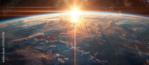 A breathtaking view of the planet Earth from outer space as the sun rises over the horizon, casting a warm glow on the surface