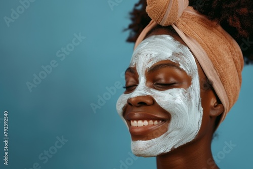 Happy glowing black woman model with beautiful smile after facial and spa treatment Isolated studio background emphasizes wellness skincare and dermatology detox