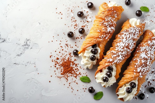 Top view image of traditional Italian dessert cannoli siciliani on a light background with space for text