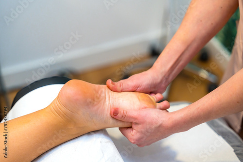 Woman receiving a foot massage in the clinic