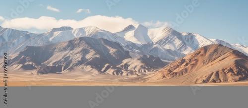 snow-covered mountains and dry fields