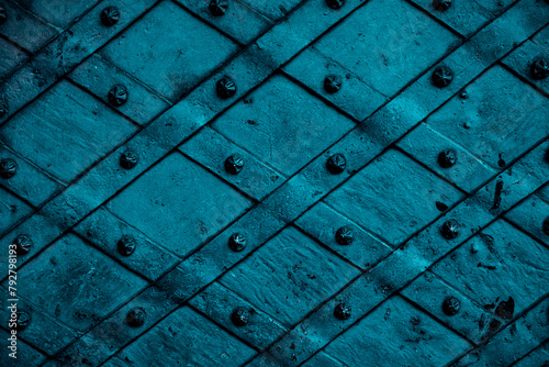 Closeup of blue forged metal door