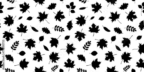 Seamless pattern with maple leaves silhouettes on white background