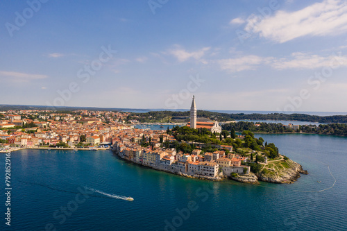 Rovinj, Croatia: Boat sailing around the Rovinj medieval old town with its Venetian campanile in Istria by the Adriatic sea in Croatia