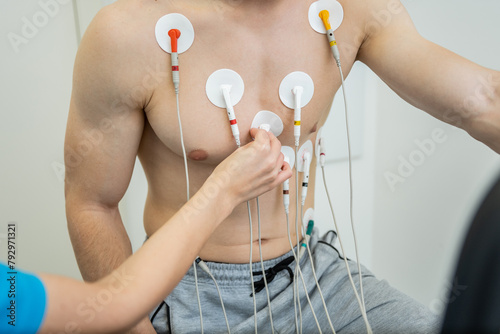 Medical professional conducting a cardiovascular evaluation with ecg electrodes