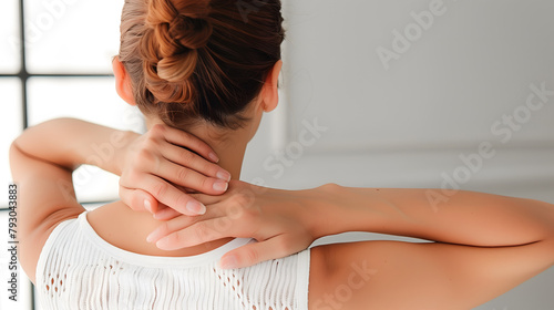 Pain in the neck muscle of Caucasian woman. Nape pain and nuchal stiffness concept.