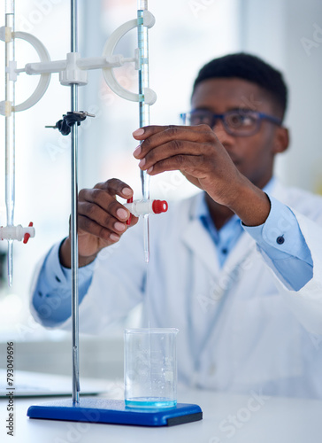 Science, burette clamp and scientist in laboratory with beaker for chemical research with liquid. Innovation, chemistry and man researcher measuring fluid with biotechnology equipment for medical