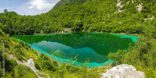 Scenic view of turquoise colored Lake Cornino near Udine in Friuli-Venezia Giulia, Italy, Europe. Peaceful serene scene on Alpe Adria trail in Italian Alps. Calcium sulphate gypsum in water. Awe