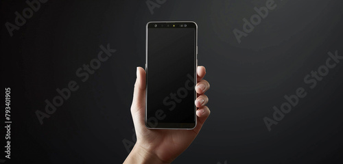 front view of hand holding a smartphone screen on black background 