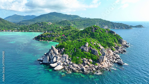 A breathtaking haven of pristine beaches, swaying palms, and azure waters. Explore hidden coves, indulge in luxury, and immerse yourself in pure serenity. Aerial view. Koh Nangyuan, Southern Thailand.