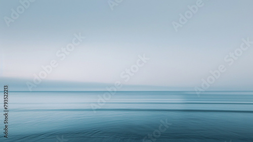 A calming palette of translucent dusky blue and gentle gray, overlaid to form a minimalist background that evokes the quiet solitude of a dusk-lit beach