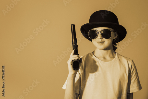 A teenage girl in a bowler hat with a gun in her hand. Vintage retro teen party. Retro color banner