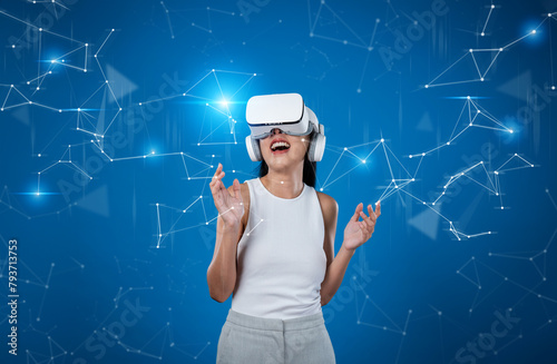 Female stand wear white VR headset and white sleeveless connect metaverse, future technology create cyberspace community. She look around and gesticulate enjoy communicate other users. Hallucination.