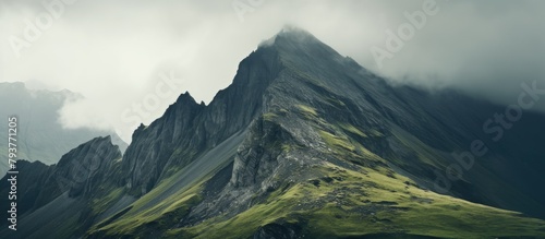 Mountain with scattered clouds