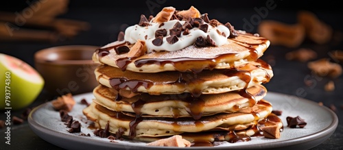 Pancakes with chocolate, whipped cream and caramel