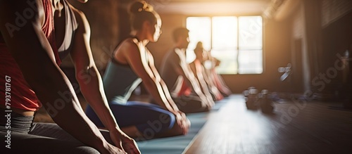 several people sit row yoga mats