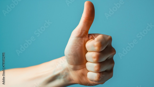 Closeup of a male hand showing thumbs up symbol on blue background. Generative AI 