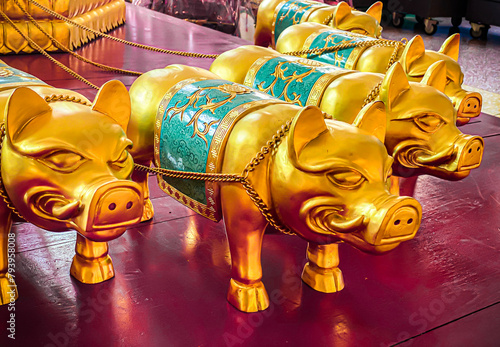 Golden pig statue is a beautiful Thai and Chinese architecture of Nachas sa thai chute shrine, naja shrine, najasaataichue, nezha shrine chinese temple. good luck Chinese New Year celebrations.