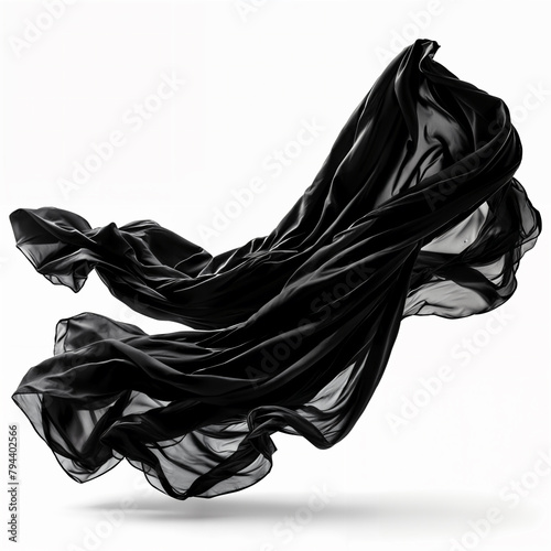 A black, flowing scarf that is captured mid-motion, creating a dynamic and artistic display against a plain background.