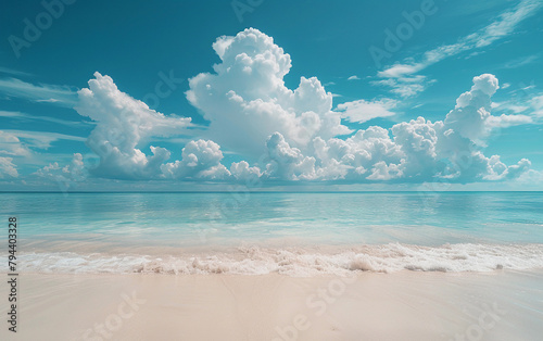 A beautiful beach with a large body of water and a cloudy sky. The sky is filled with clouds, creating a moody atmosphere. The beach is calm and peaceful, with the waves gently lapping at the shore