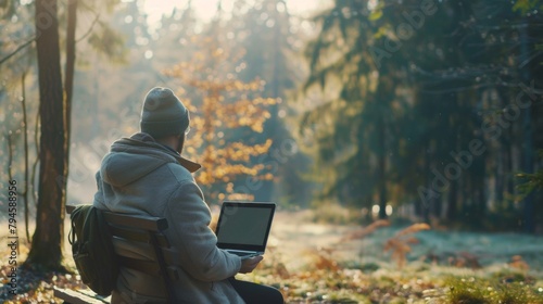 A serene setting in nature with a person sitting alone on a bench laptop in hand lost in their own thoughts as they work on a coding project amidst the peaceful sounds of the surrounding .