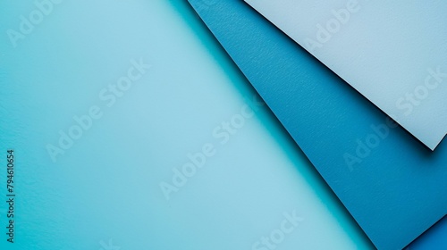 a blue background with a few different shapes of paper on it