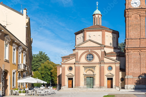 Square with church, bell tower and bar. Historic center of Legnano city, piazza San Magno (square Saint Magno) with the Basilica of San Magno (XVI century), Lombardy region, Italy