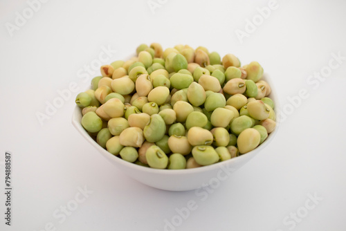 Fresh Green black eyed peas beans lili chori in a white bowl on white background