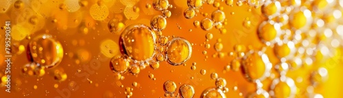 Closeup of bubbles in amber liquid.