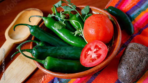 Green Spicy Serrano Peppers with Tomatoes and Coriander. Ingredients for Mexican food cuisine. Serrano chili.