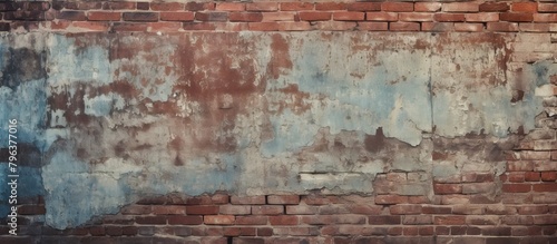 Vintage weathered brick wall with peeling blue paint