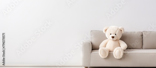 Teddy bear on couch in room