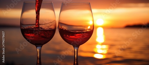 Two wine glasses with red wine on table