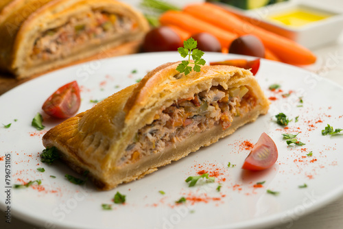 Traditional Galician empanada filled with vegetables and anchovies. Traditional recipe from the northern part of Spain.