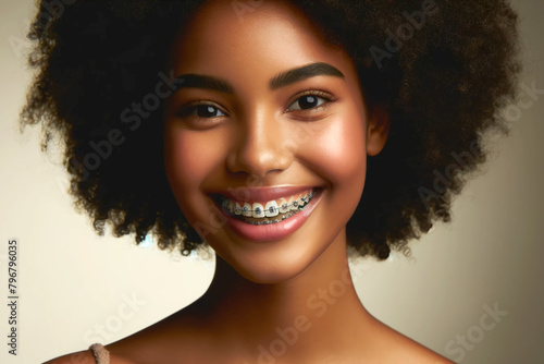 portrait of a smiling black girl in braces