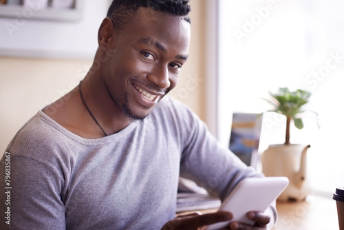 Tablet, portrait and happy black man in cafe, reading email or notification for social media blog online in Nigeria. Smile, tech or face of student in coffee shop on website, network or scroll on app