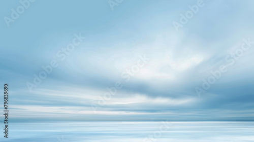 Tranquil blue seascape with serene clouds and smooth water for a calming background