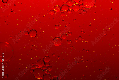 Macro red bubble texture close-up,red macro bubbles,Backgrounds, Abstract Backgrounds, Soda, Red, Carbonated,Beauty concept background. Closeup cosmetic liquid gel with bubbles on red colors backgroun