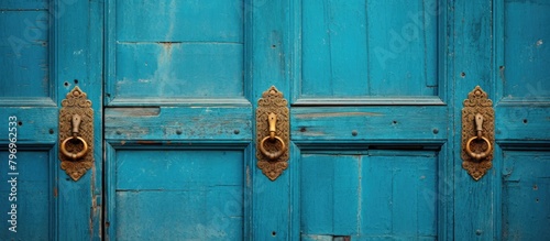 Blue door with brass knock handles