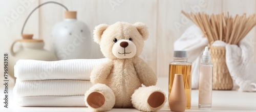 A bottle beside a plush bear