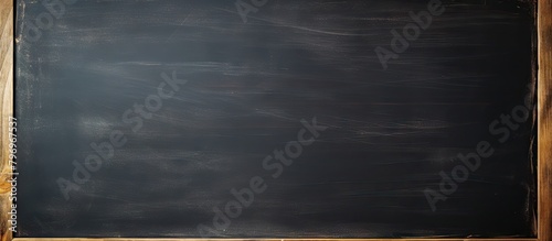Blackboard with wooden frame and chalk