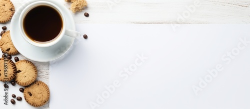Close up of coffee cup and cookies on the table